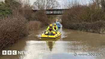 Man trapped in car rescued from flood water