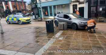 Car crashes into town centre bollard closing side street