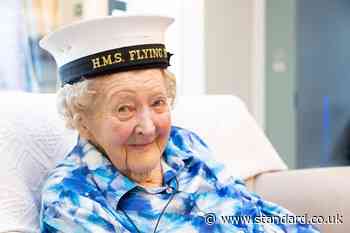 Former headmistress presented with Naval cap to celebrate 100th birthday