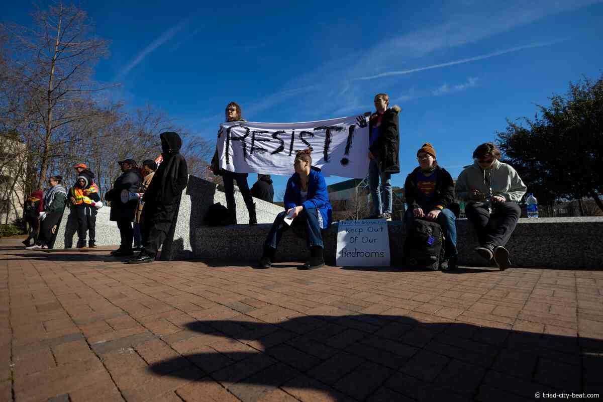 GALLERY: Dozens march in Greensboro to protest Trump presidency