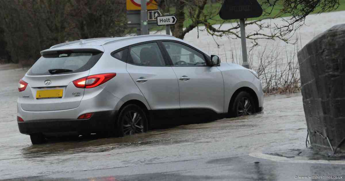 PHOTOS: Another day of disruption as cars stranded in floods