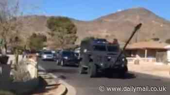 Army of ICE agents arrive in military tank with battering ram to arrest 61-year-old migrant