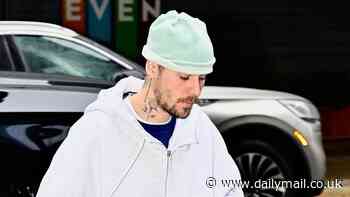 Scruffy Justin Bieber flashes his boxers as he's pictured out again solo in New York amid fan concern