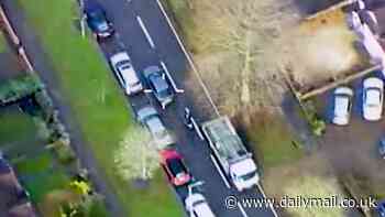 Moment police ram motorbike thief off the road after he sped through residential streets in terrifying 80mph chase