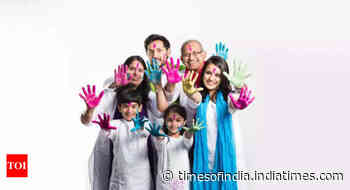 Why do people wear white on Holi?