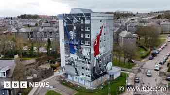 Denis Law murals painted on high-rise city block