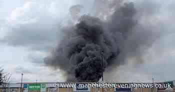 Residents hear 'explosions' as firefighters tackle enormous blaze in Altrincham