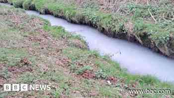 Action urged over waterway turned 'milky-white'