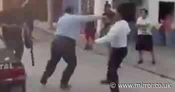 Rival funeral workers brawl in street over who gets to take body of man killed by electric shock