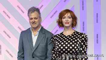 Christina Hendricks puts on a leggy display in a polka dot dress as she joins husband George Bianchini at Series Mania Festival in France