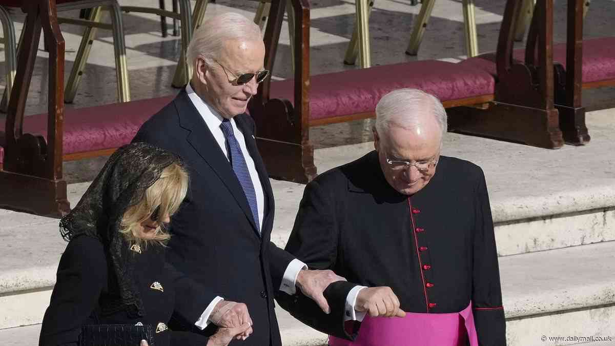 Moment frail Joe Biden forced to grab arm of elderly priest as he struggles to walk unaided at Pope Francis's funeral