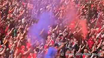 Rival fans prank Liverpool's Premier League title celebrations as Everton supporter covertly replaces their red flares with BLUE on their big day