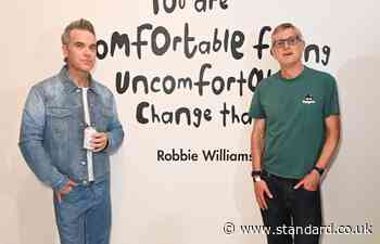 Celebs gather in support of Robbie Williams at launch of singer's art project