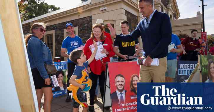 Swimmers, dogs and democracy sausages: Australian election day – in pictures