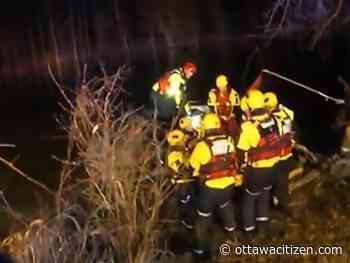 Fire crews rescue driver from car submerged in Jock River