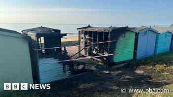 Barbecue in bin blamed for beach huts fire