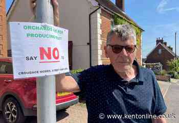 Villagers rally against 100-home plan for orchard