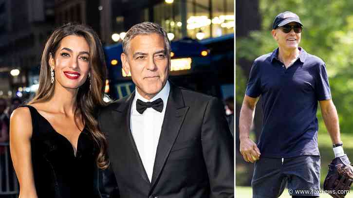 George Clooney appears unbothered playing softball amid reports his wife could be barred from future US visits