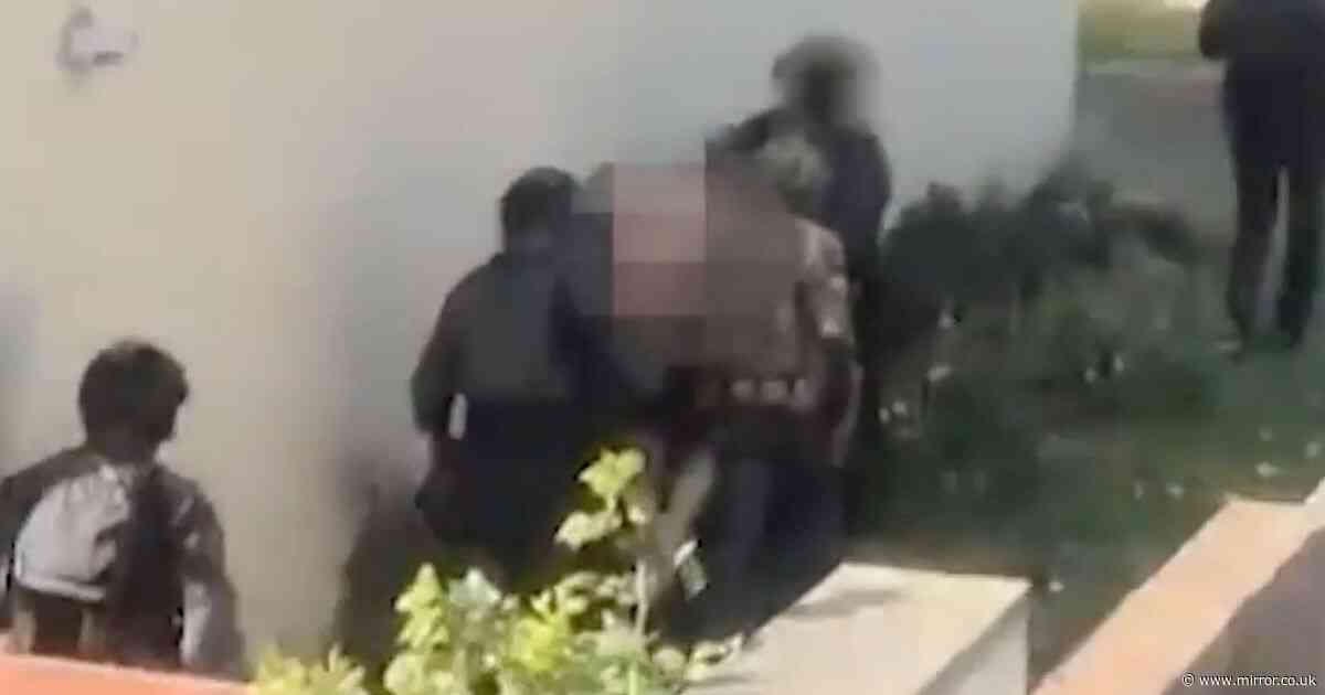Moment armed cops storm home as UK terror swoops see eight men arrested