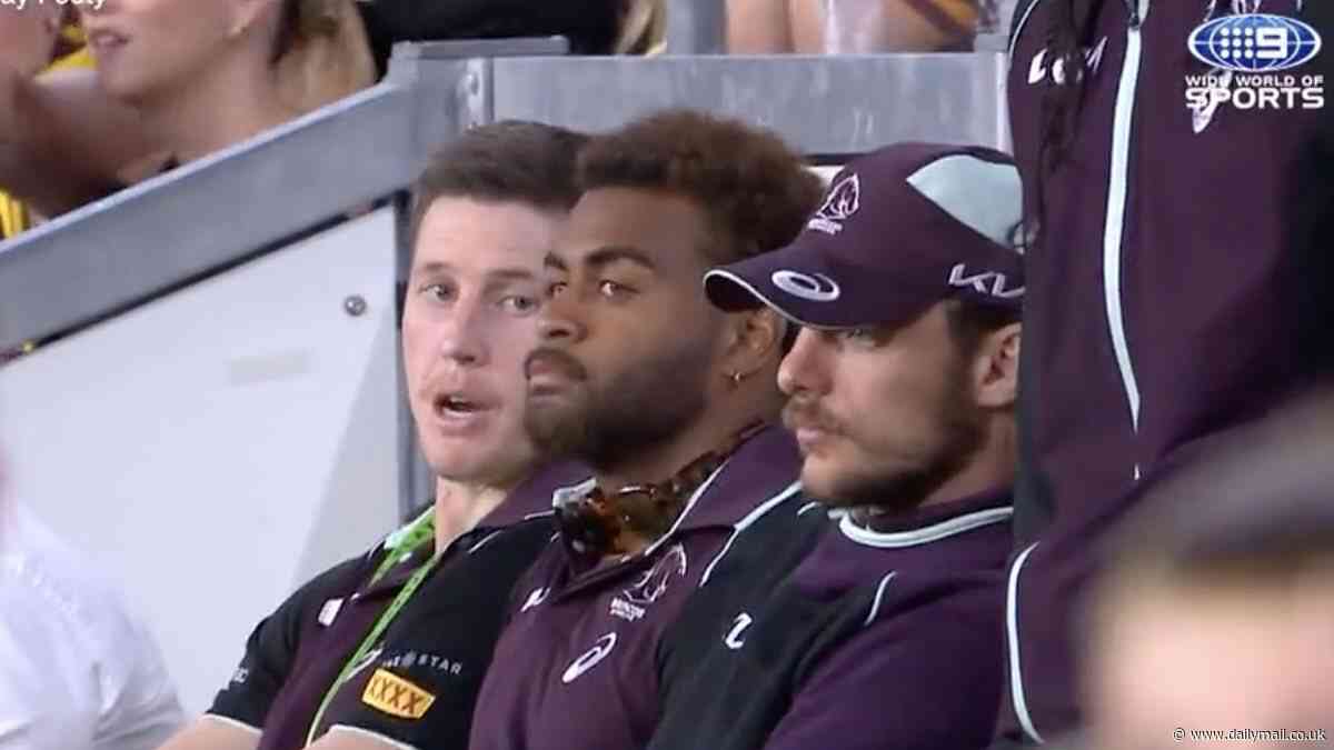 Broncos star cuts an awkward figure after being booed by fans as he returns to watch his team play following drug driving scandal