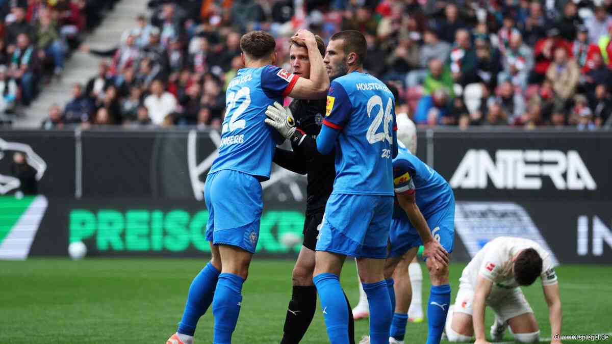 Fußball-Bundesliga: Holstein Kiel schlägt FC Augsburg und sitzt Heidenheim im Nacken