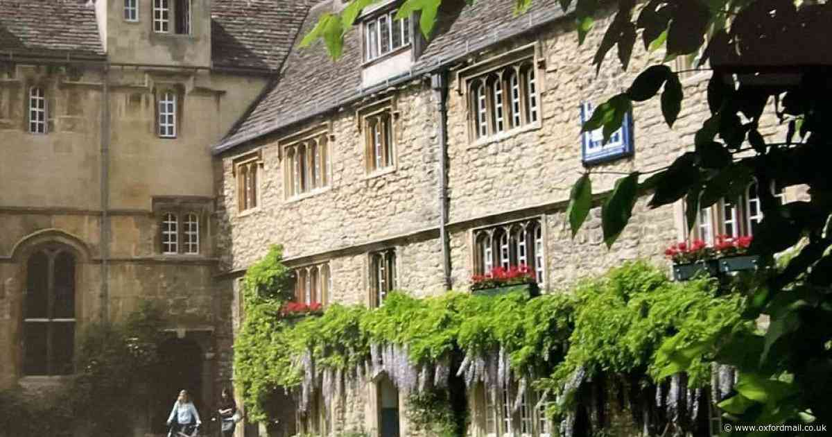 Students strolling in leafy college quad winning photo