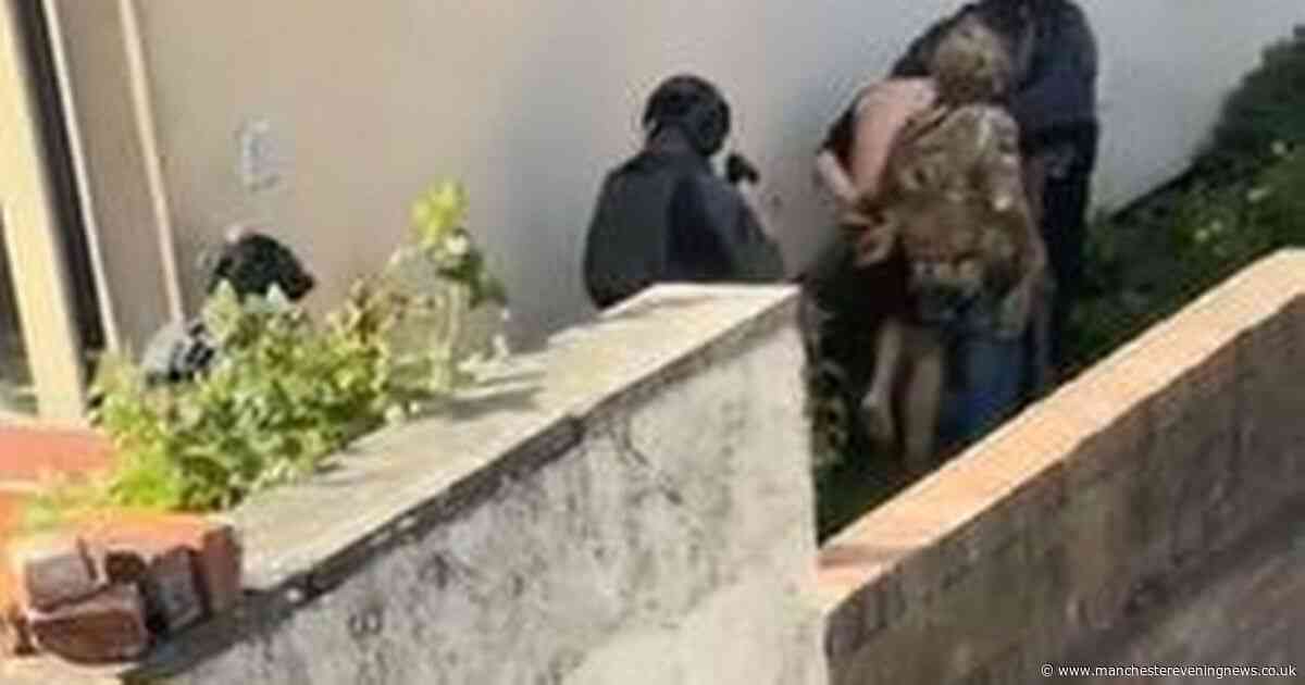 Moment man is marched outside in underwear after police raid home in terror plot probe
