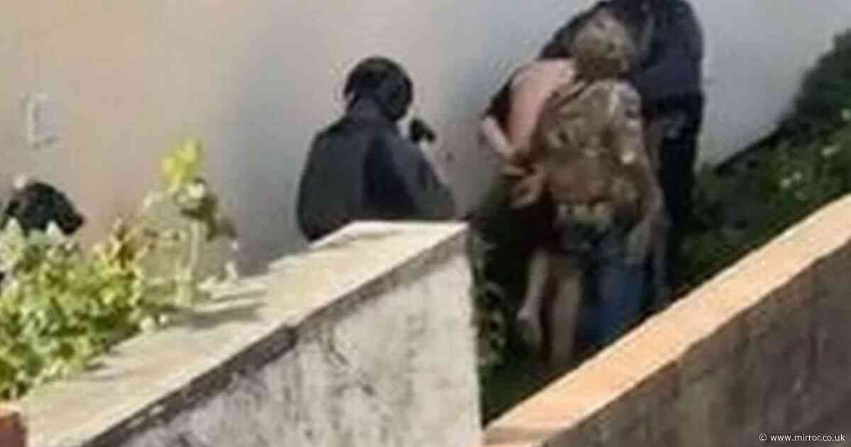 Moment man marched outside in underwear during raid over suspected terror plot