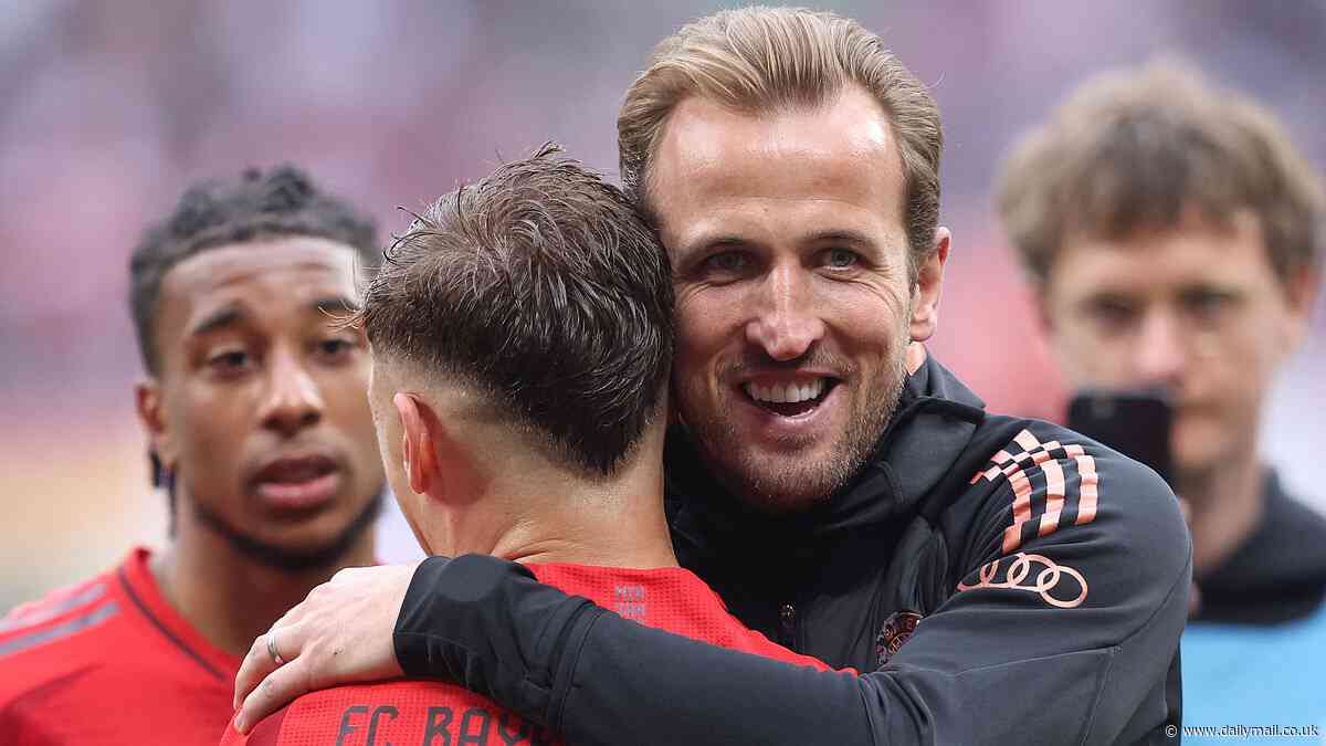 Harry Kane celebrates the FIRST trophy of his career aged 31 with Eric Dier and his Bayern Munich team-mates - after Bayer Leverkusen slipped up to hand Vincent Kompany's men Bundesliga title