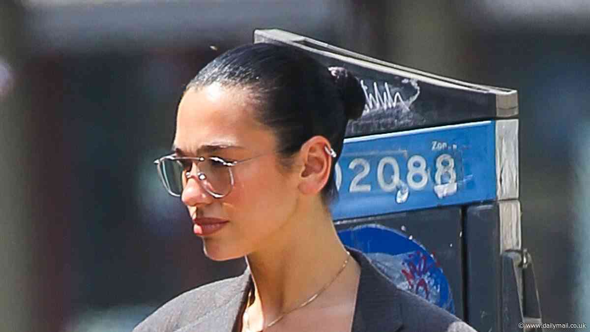 Dua Lipa flashes her underwear under a nude sheer skirt as she shows off her toned legs for a date with fiancé Callum Turner in Manhattan