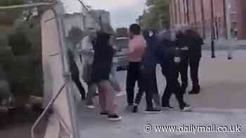 Topless Championship football star is dragged away from bloody 'street brawl' after 'pub row' stopped traffic