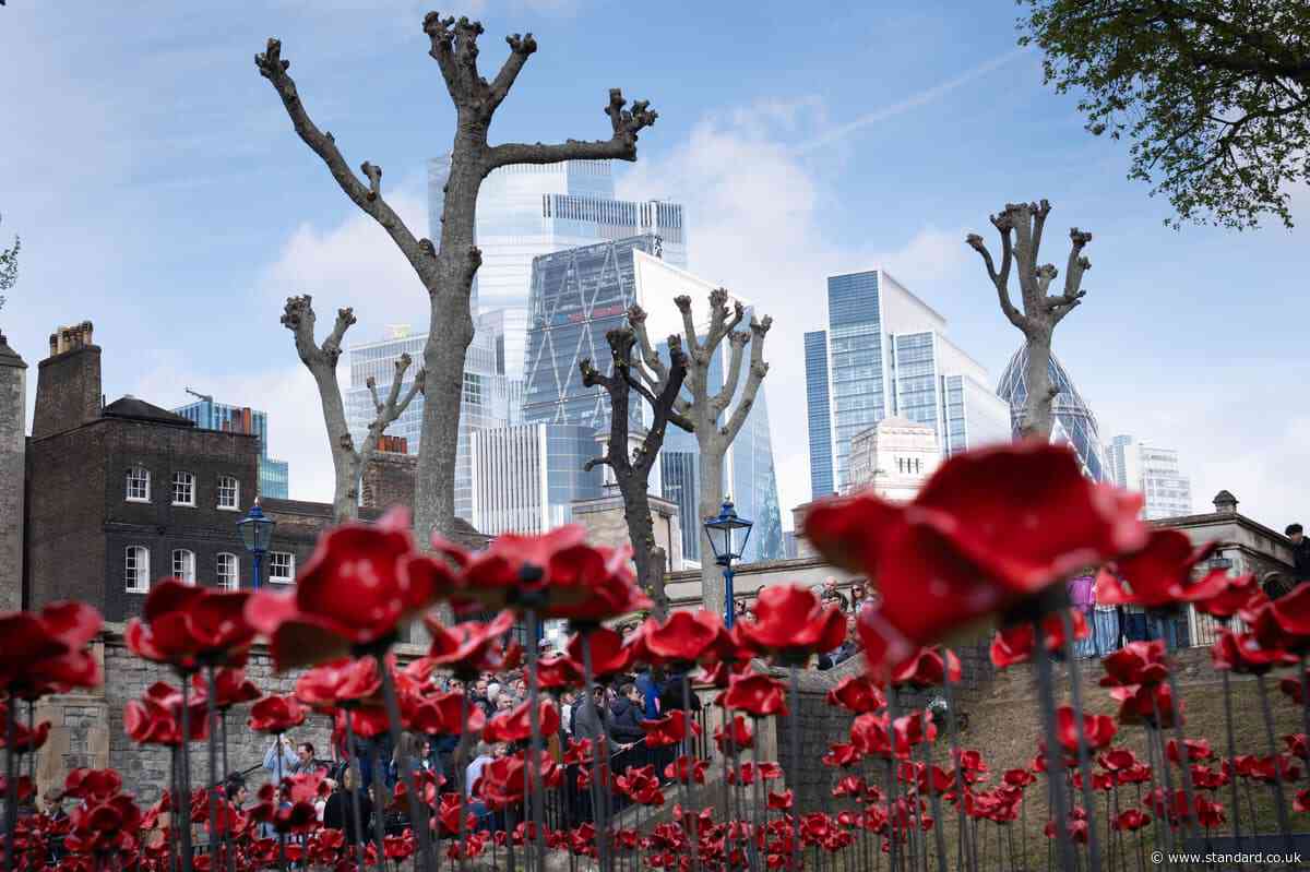 Blood-red poppies pour over the Tower of London to mark 80 years since end of Second World War