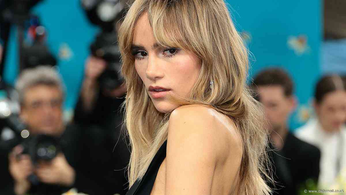 Suki Waterhouse flashes her sideboob in daring black tuxedo dress as she turns heads at Met Gala 2025