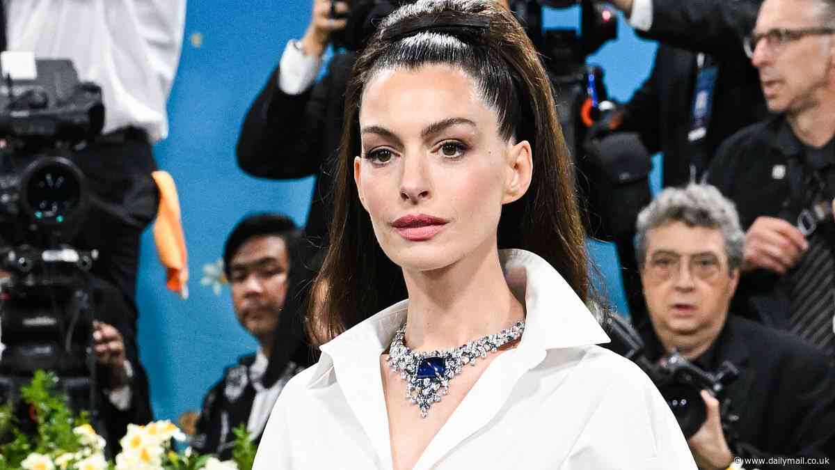 Anne Hathaway continues fueling plastic surgery rumors as fans react to her smooth new face at 2025 Met Gala