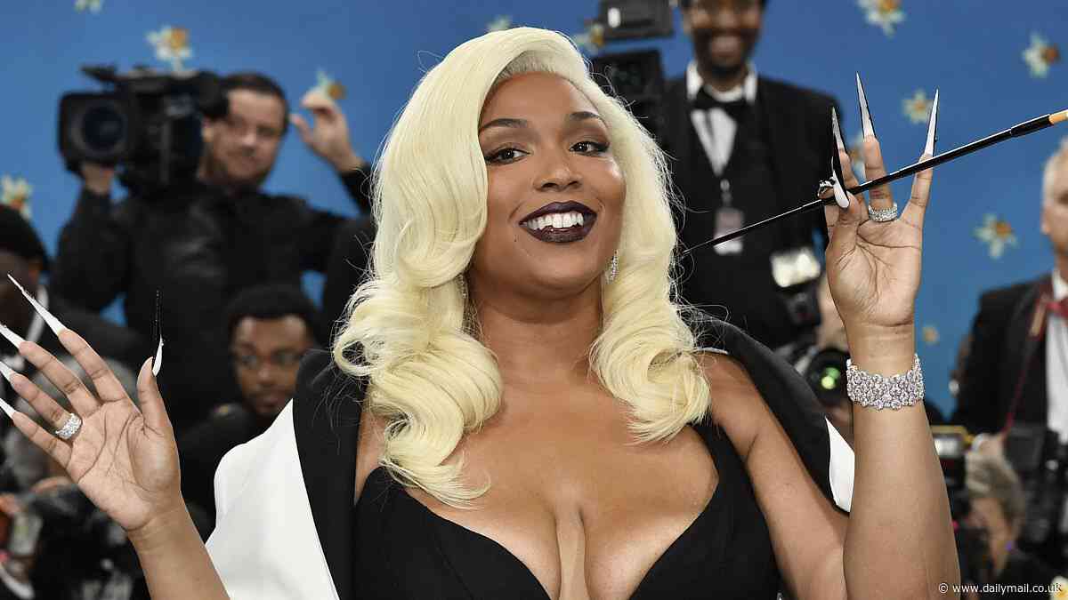 Lizzo looks sensational as she shows off weight loss at the Met Gala in figure-hugging black and white mermaid gown