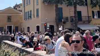 Fury in Italy as 75,000 tourists jam streets of quaint Lake Garda village as video shows arguing holidaymakers trying to barge their way in to fairytale castle