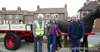 Volunteers restore weather-beaten historic cart as reminder of village's past