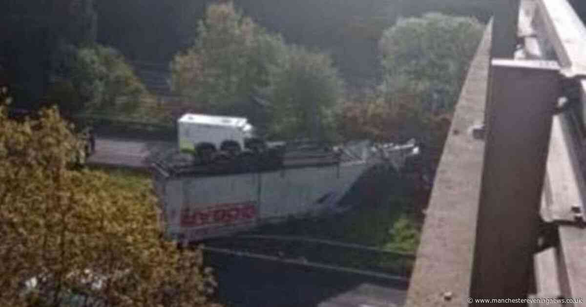 Lorry plunges from motorway bridge and lands on its roof on dual-carriageway