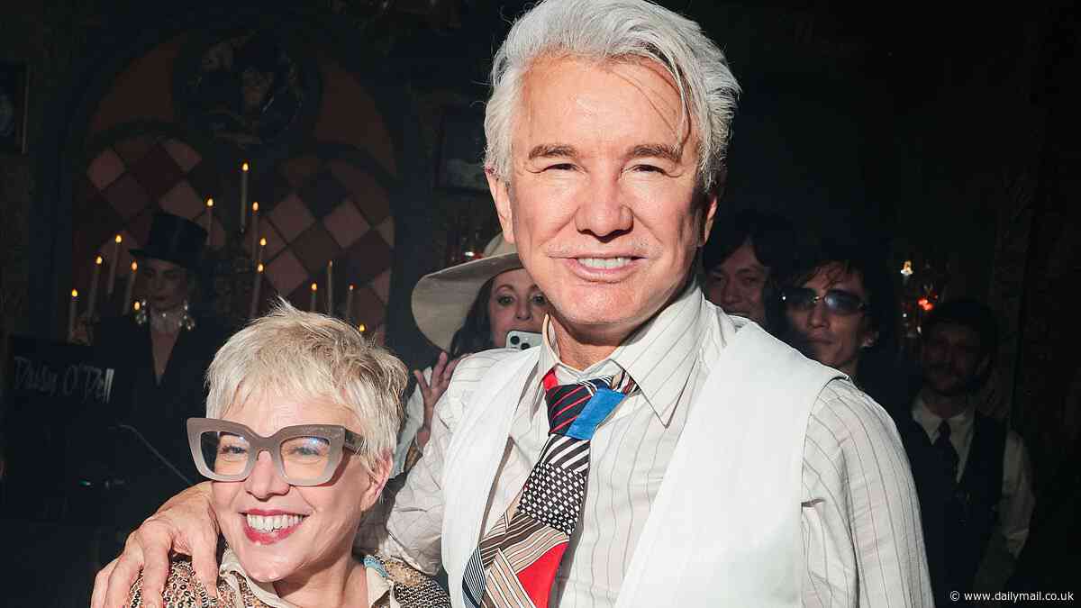 What split rumours? Baz Luhrmann and wife Catherine put on VERY amorous display as they lock lips at wild Met Gala after party - following speculation about their 'separate lives'