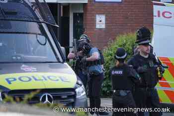 Police issue statement after armed officers storm streets and raid house