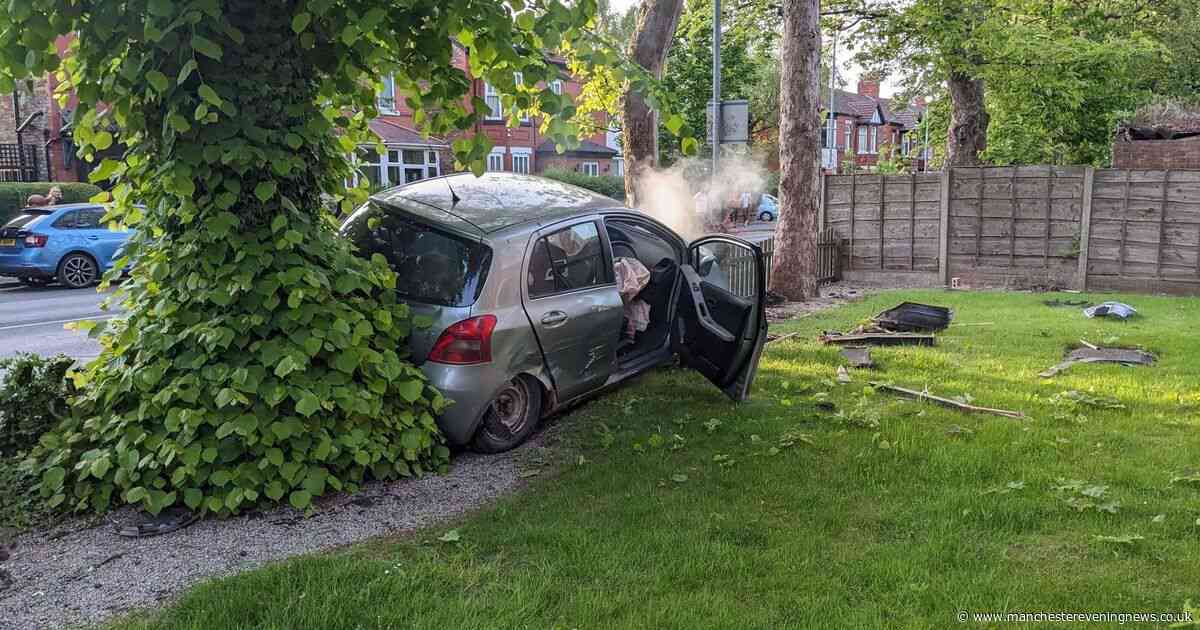 Car is smashed through wall and into tree outside flats before occupants 'flee scene'