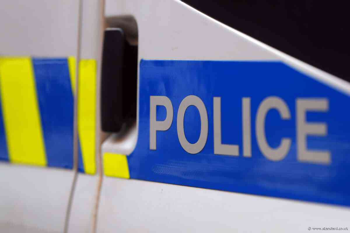 Two men arrested after customer stabbed to death in city centre bank