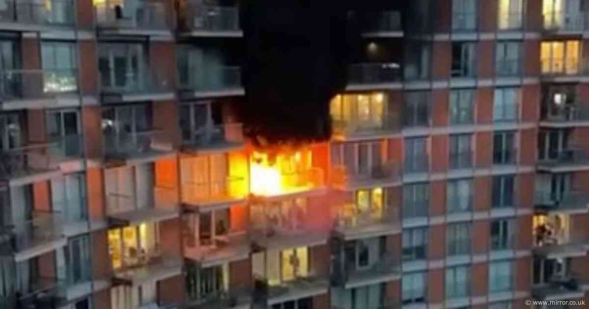Huge fire erupts opposite O2 arena as flames pour from tower block