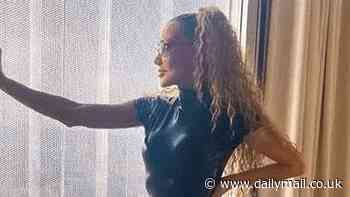 90s pop star, 55, hasn't aged a day as she poses in racy leather catsuit - but can you guess who she is?