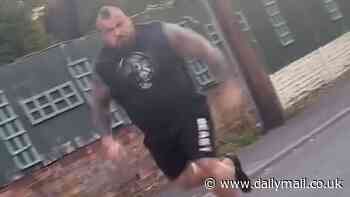 Former World's Strongest Man Eddie Hall is interviewed by police 'over 'I'll rip your head off' rant at driver he chased down the street in shocking footage