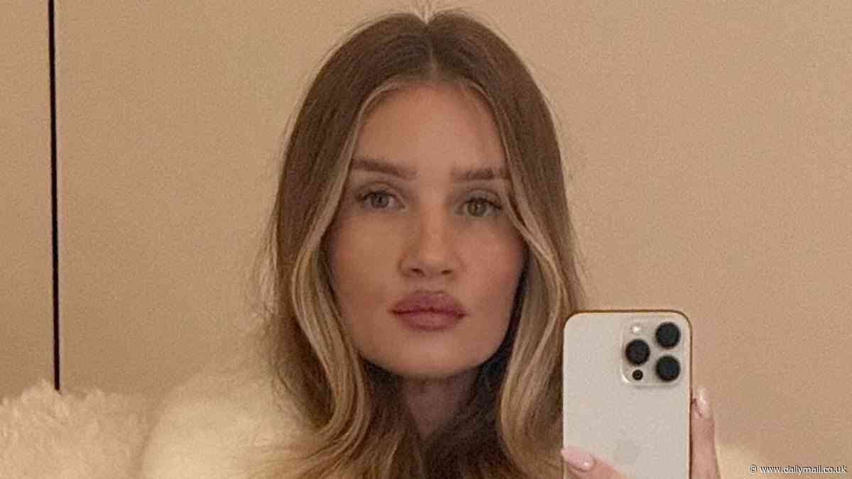 Rosie Huntington-Whiteley looks effortlessly chic in a cream faux-fur coat after hitting the gym