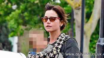 Jenna Coleman looks every inch the doting mother as she takes her baby for afternoon stroll