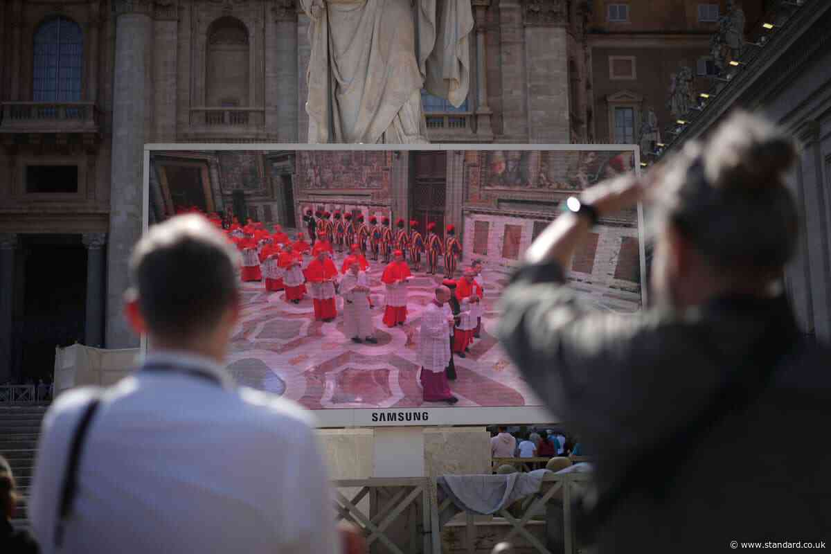 All eyes on Sistine Chapel for smoke as secret conclave begins to elect new pope