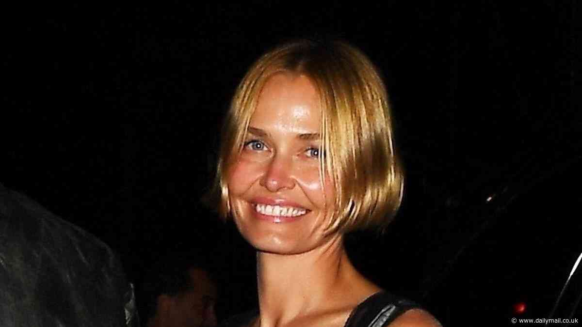 Lara Worthington dons a sheer corset over a white nightdress as she arrives at a Met Gala afterparty in New York City