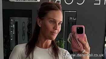 Danielle Lloyd shows off her shrinking figure after 1.3 stone weight loss as she poses in gym gear